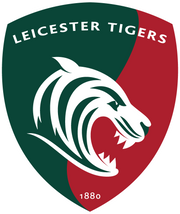 Leicester Tigers Rugby logo featuring a roaring white tiger head inside a red and green split shield with the text "Leicester Tigers" at the top and "1880" at the bottom.