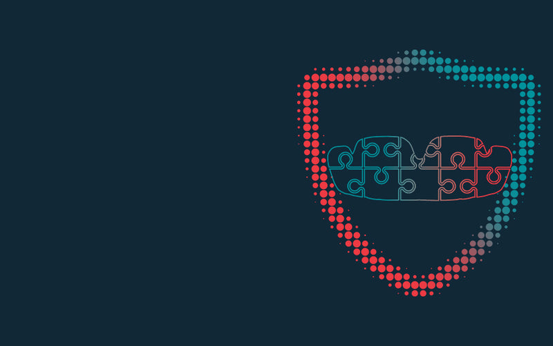 Abstract illustration of a mouthguard made from puzzle pieces inside a dotted red-to-blue shield outline on a dark background, symbolizing protection and fit.