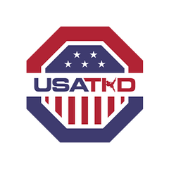 USA Taekwondo logo featuring a red, white, and blue octagon design with stars, stripes, and bold text.