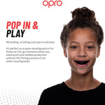 Advertisement for Opro mouthguard with a child wearing it, featuring text about the product.