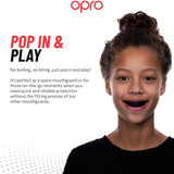 Advertisement for Opro mouthguard with a child wearing it, featuring text about the product.