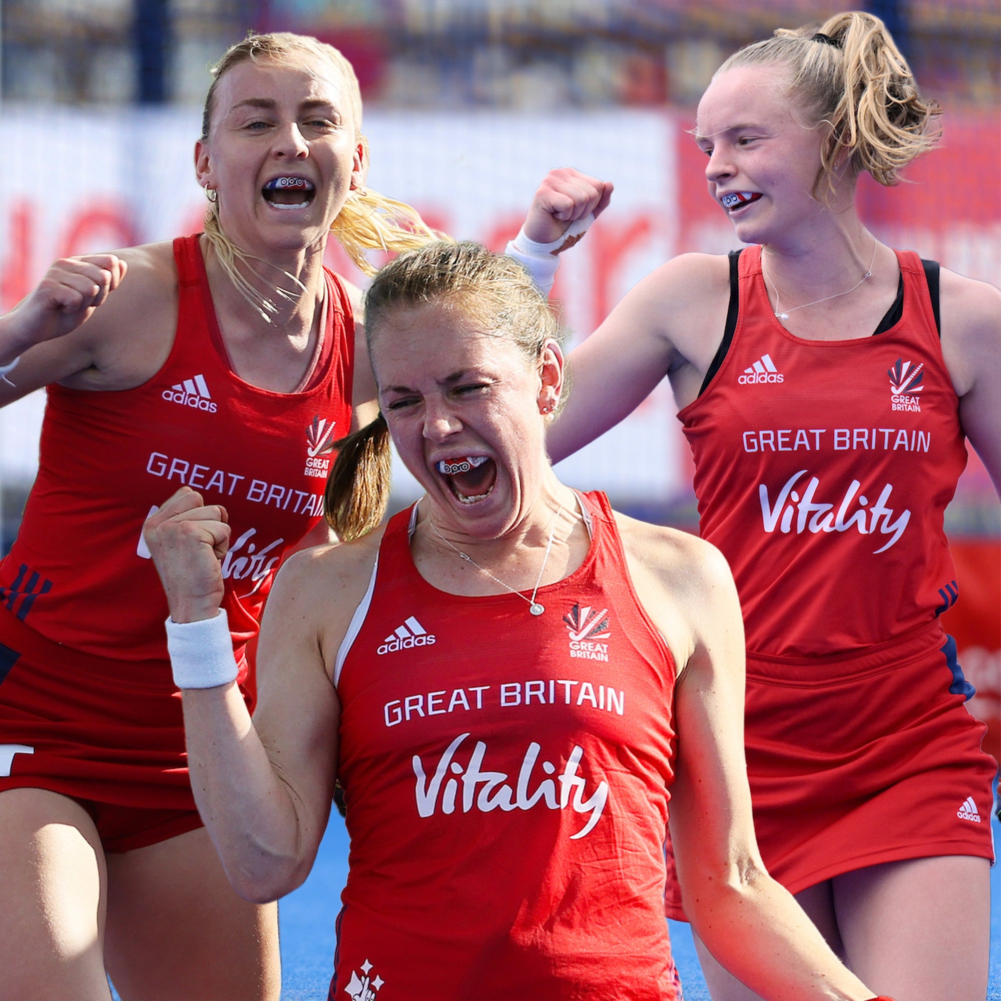 Three athletes in red 'Great Britain Vitality' uniforms celebrating.