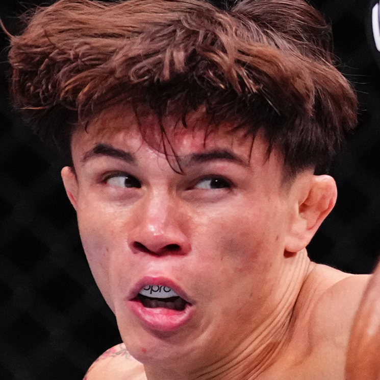 Two fighters in a close-up shot with one wearing a UFC glove.